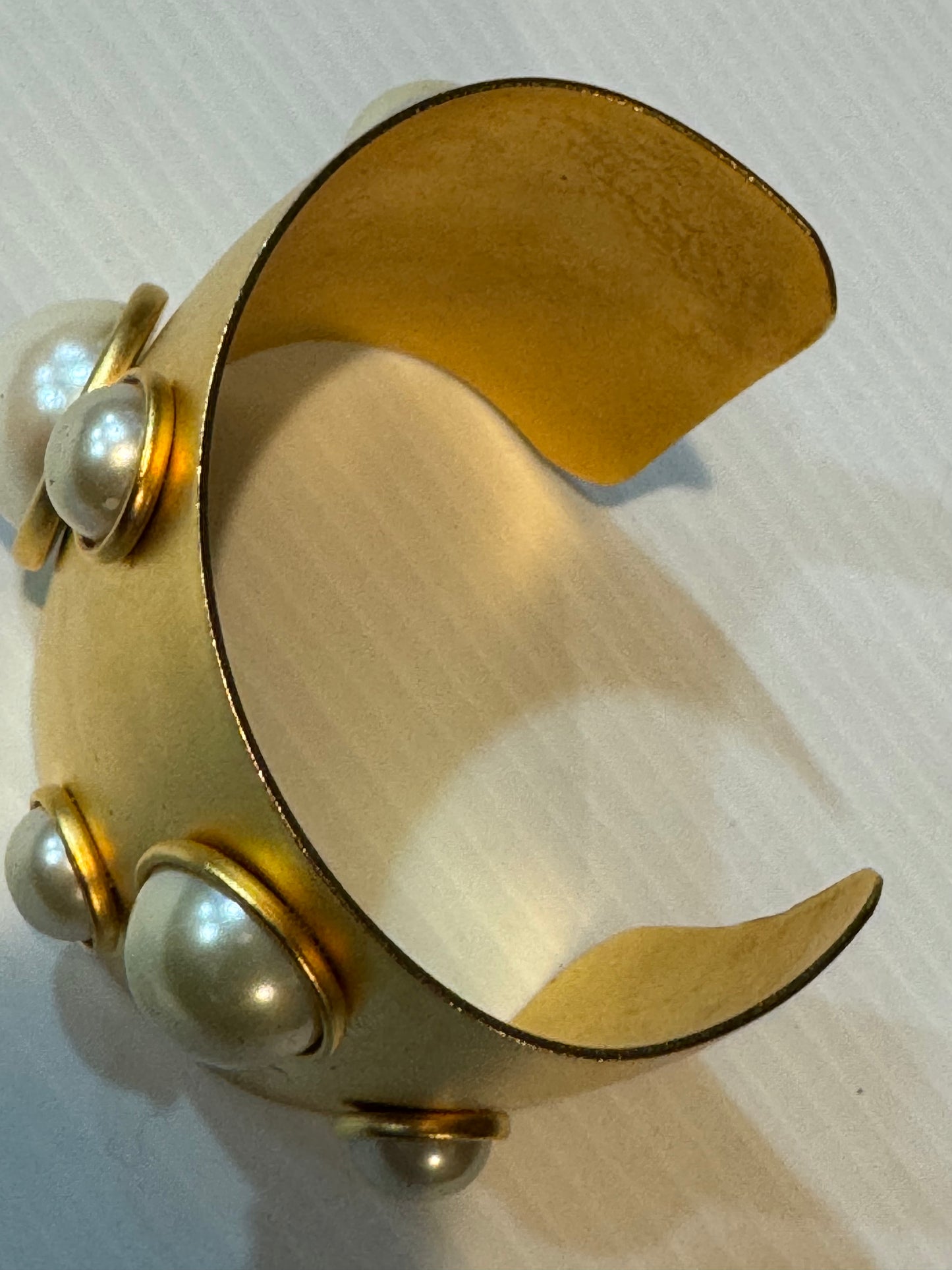 Jumbo 1990s gold tone cuff bracelet with pearls.
