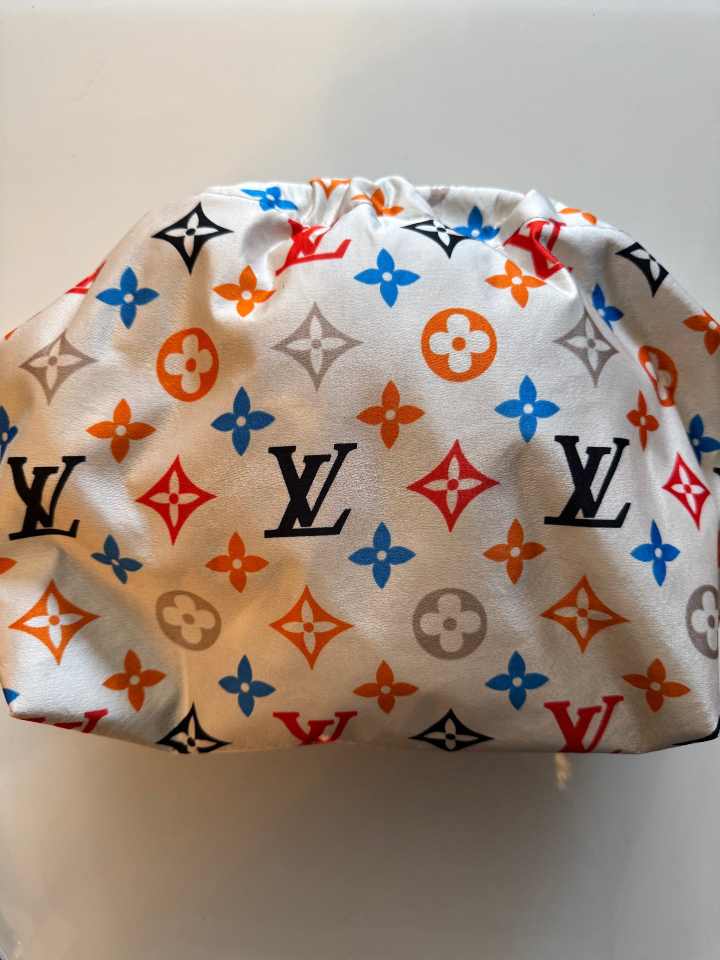 Vintage large silk scarf reimagined as a clutch bag. Comes with chain shown