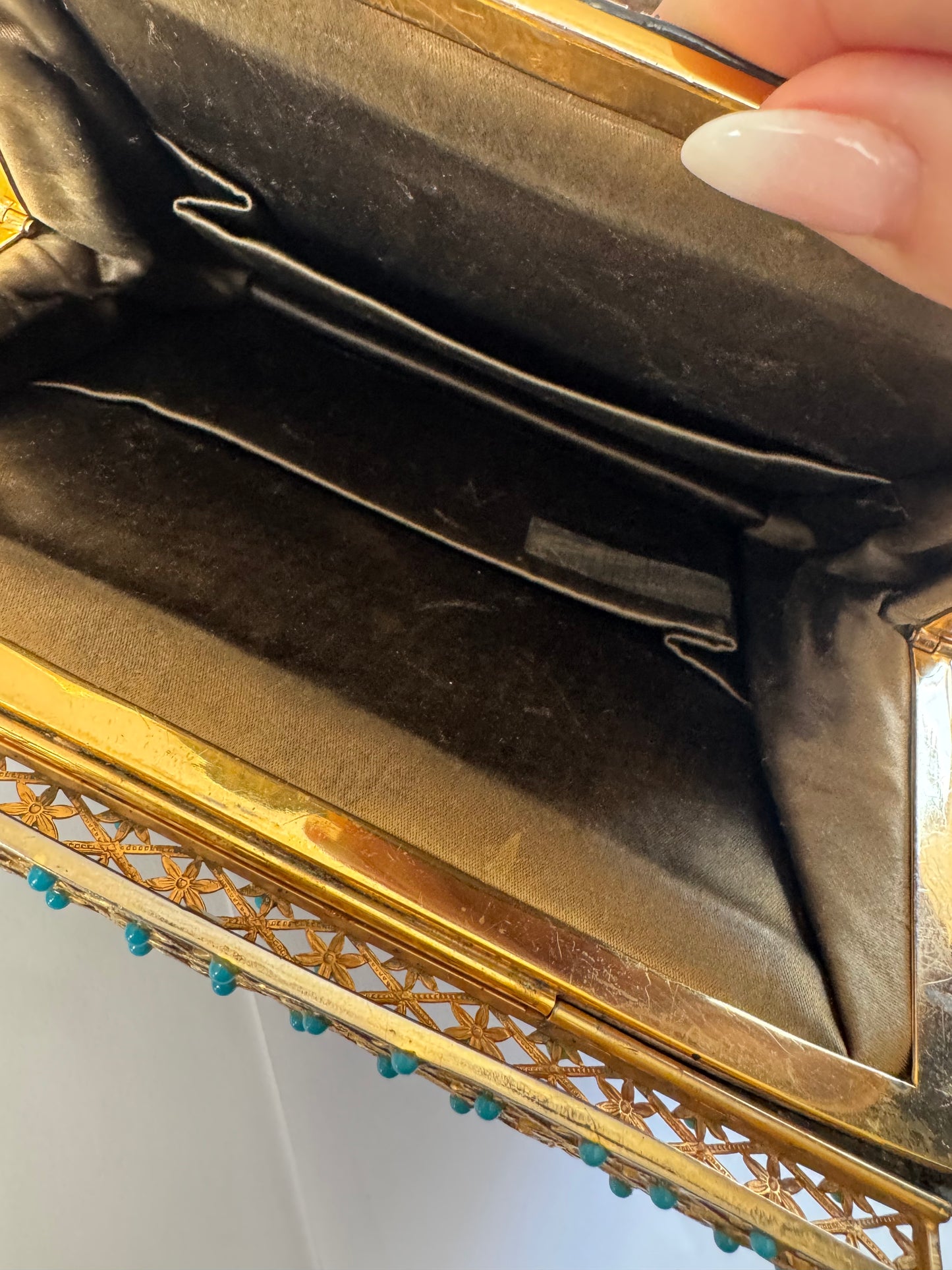 1950s glamorous black crocodile clutch with decorative flower closure in gold tone and turquoise