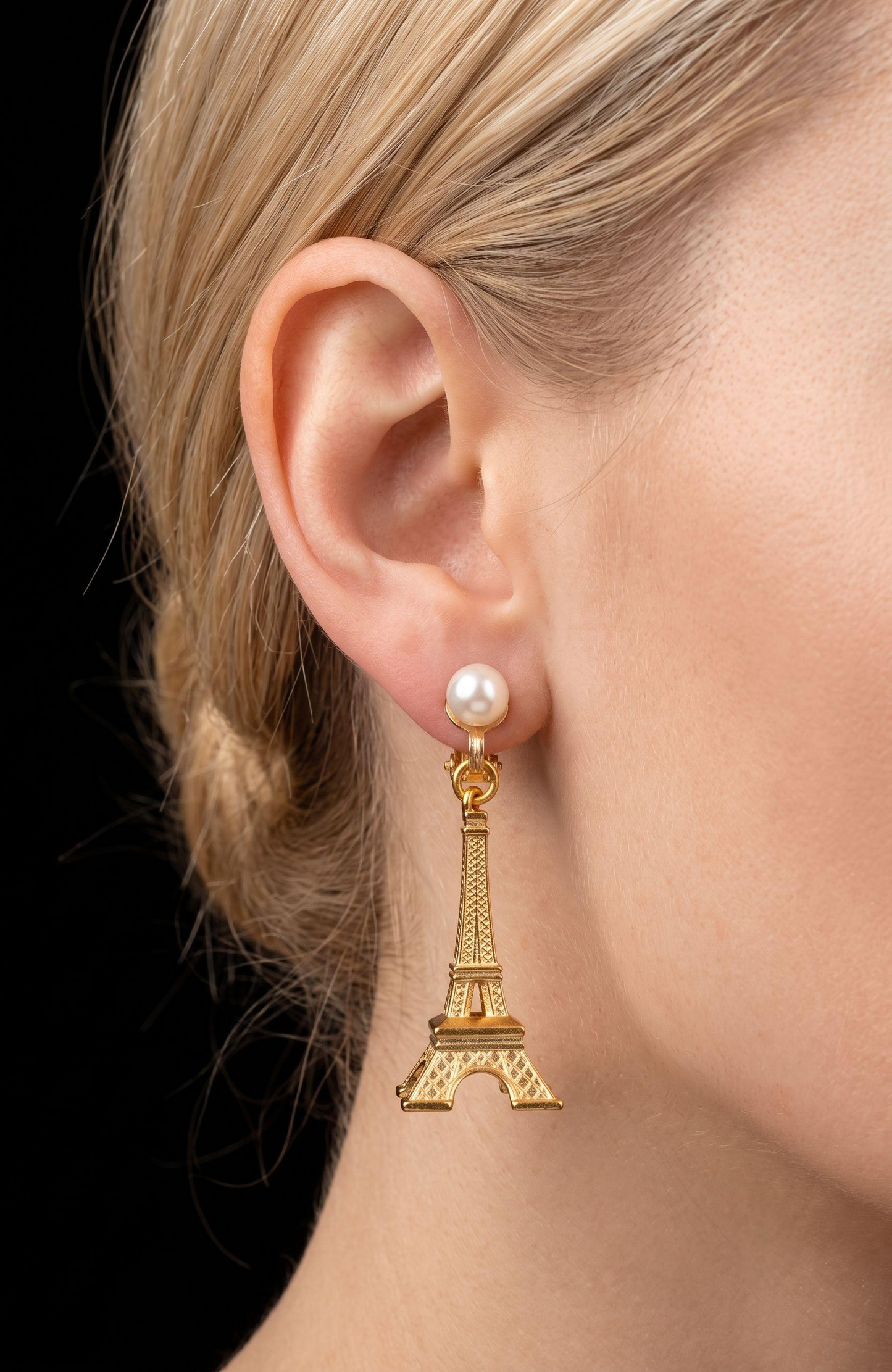 Vintage clip on Eiffel Tower with pearl earrings. From the collection of Linda Fargo