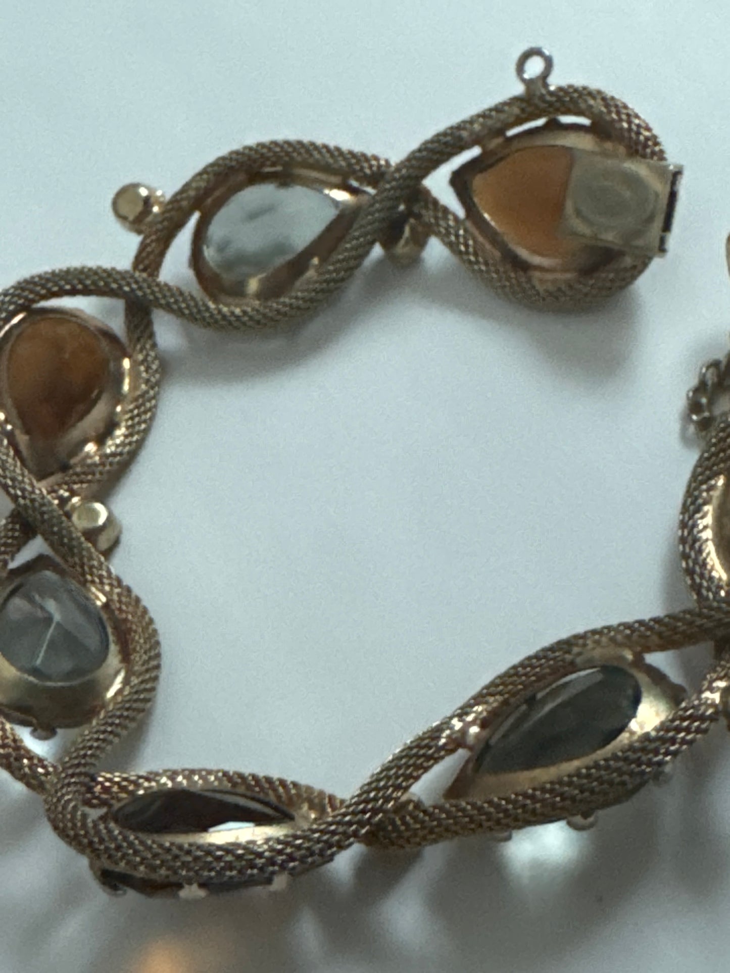 1950s signed HATTIE CARNAGIE smoky gray, and topaz bracelet with delicate gold tone rope motif  throughout