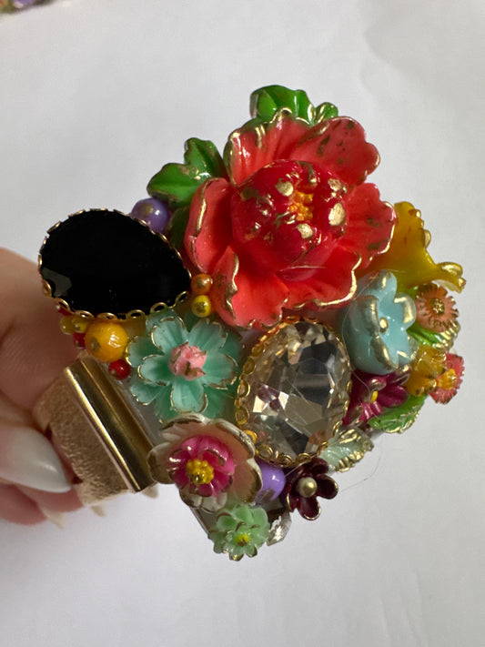 Lovely vintage repurposed clamper bracelet featuring flowers and rhinestones