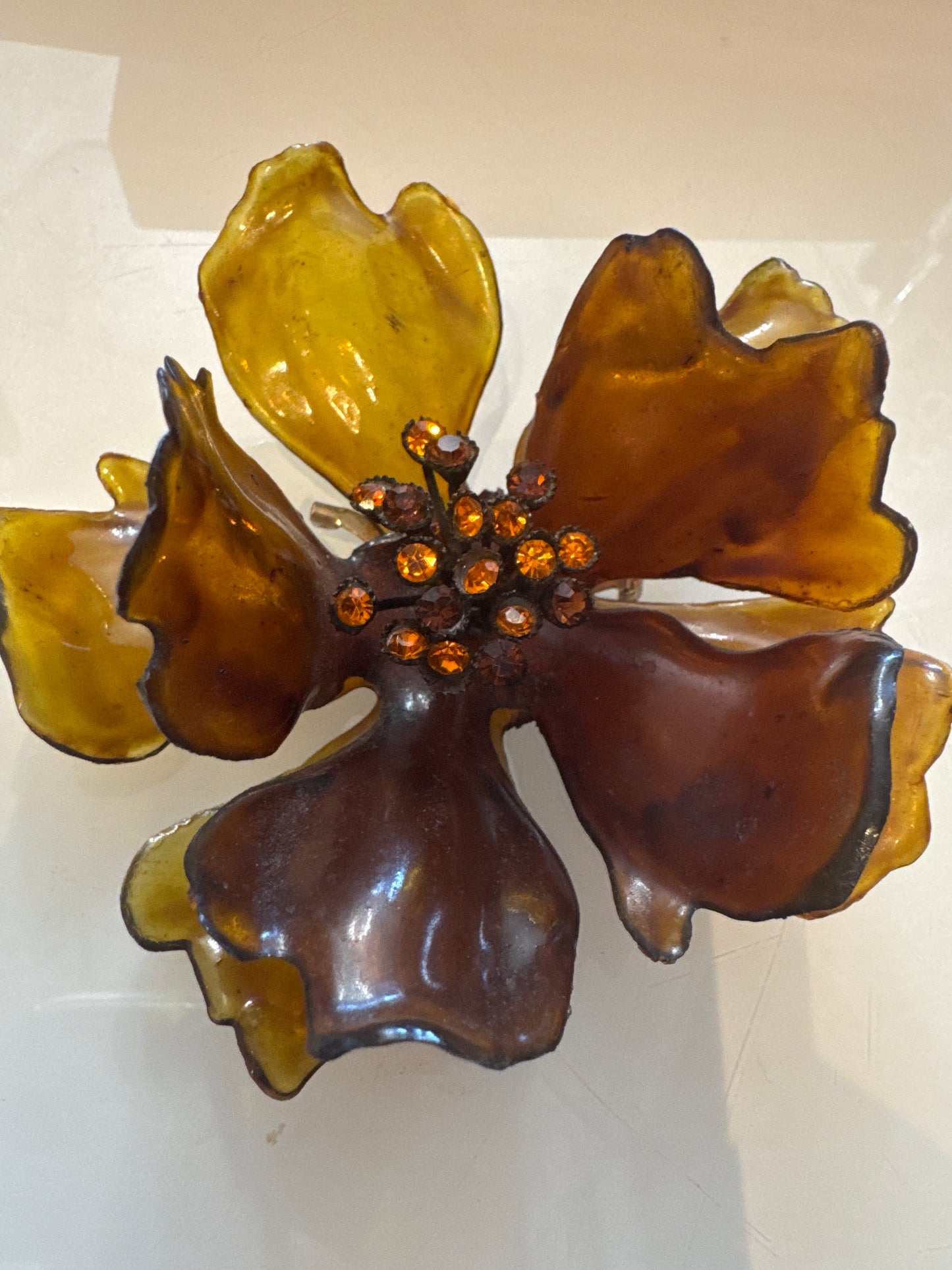 1960s giant amber colored lucite brooch with center rhinestones