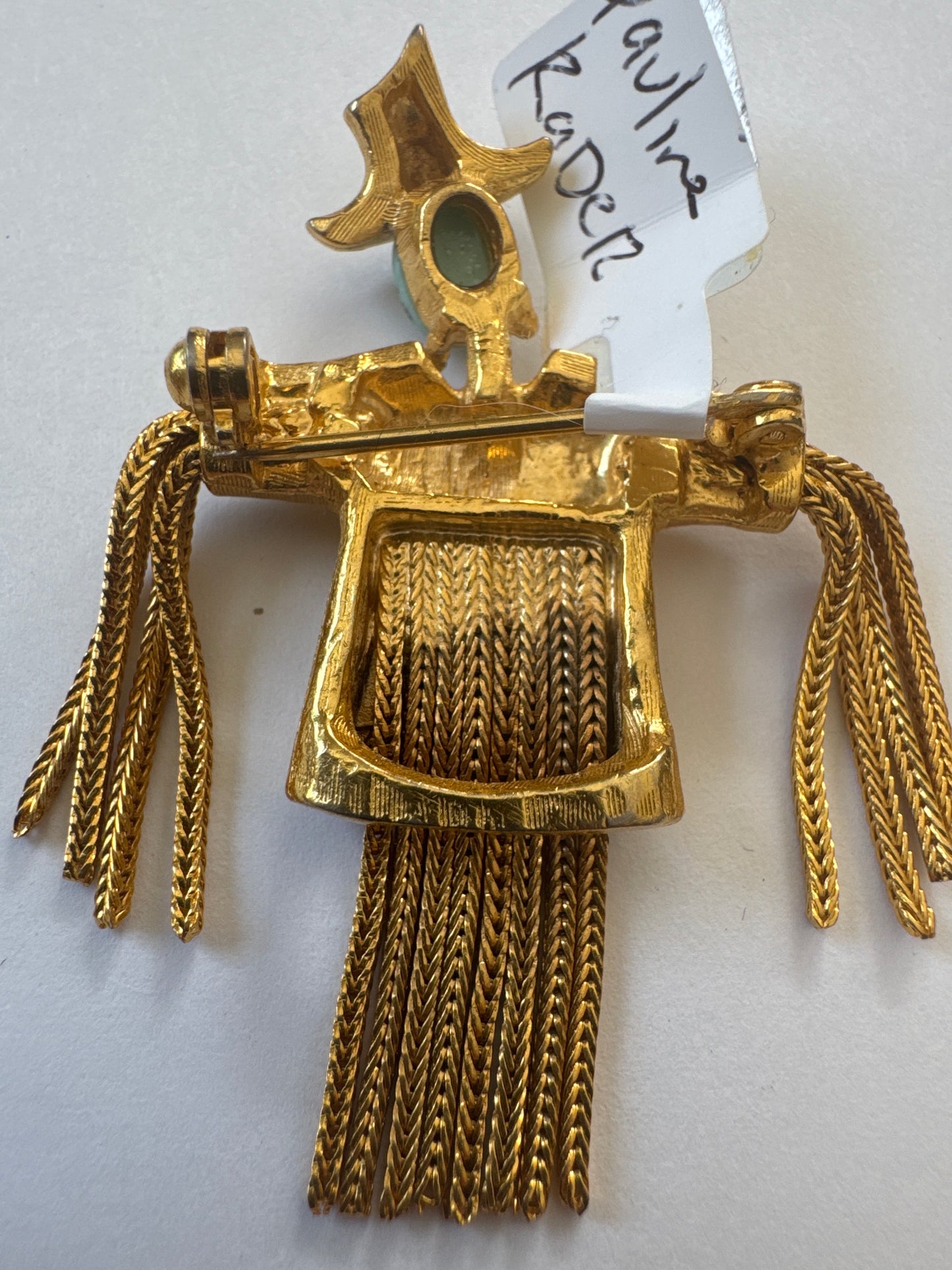 1960s unsigned PAULINE RADER book piece ~ scarecrow brooch with turquoise cabochon face, rhinestone in gold tone shirt, and dangling braided body.