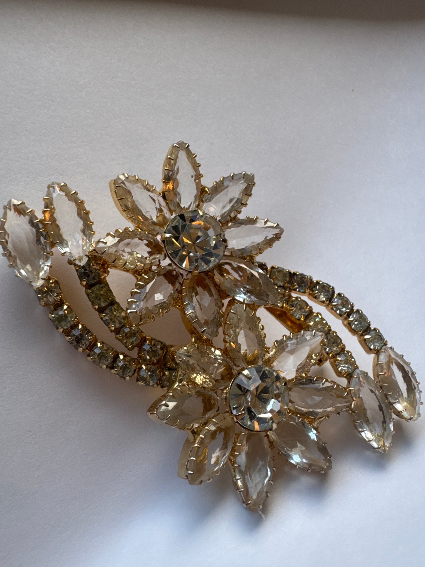 Beautiful vintage floral spray, gold tone and clear navette brooch