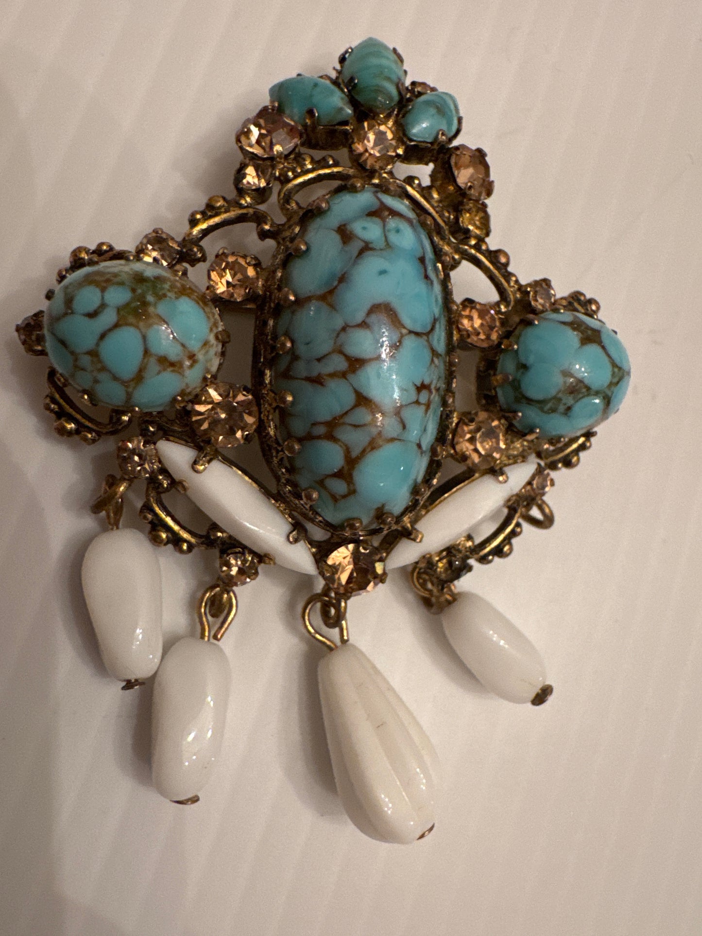 Beautiful 1940s gold tone brooch with turquoise and rhinestones with white dangle milk glass