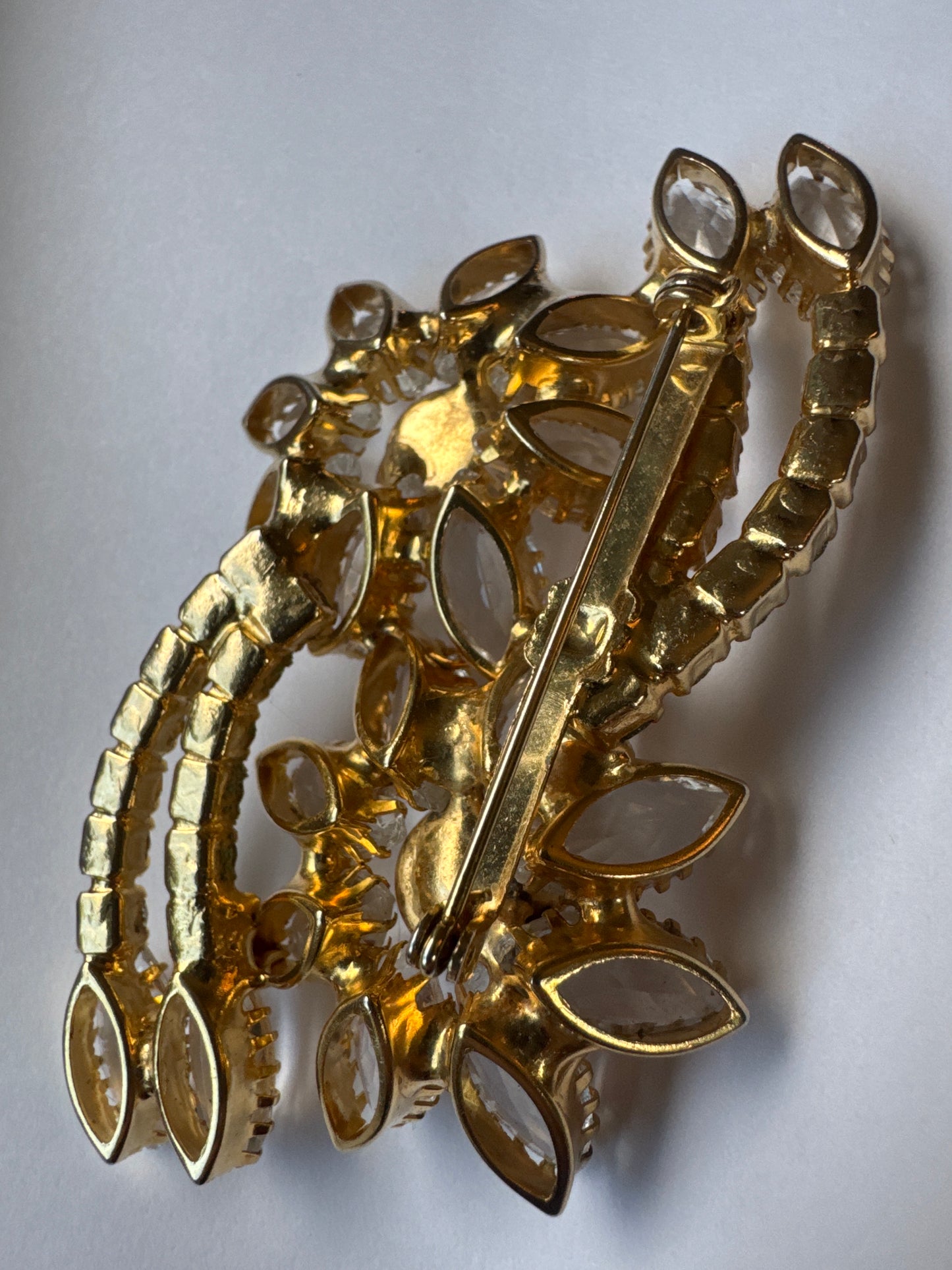 Beautiful vintage floral spray, gold tone and clear navette brooch
