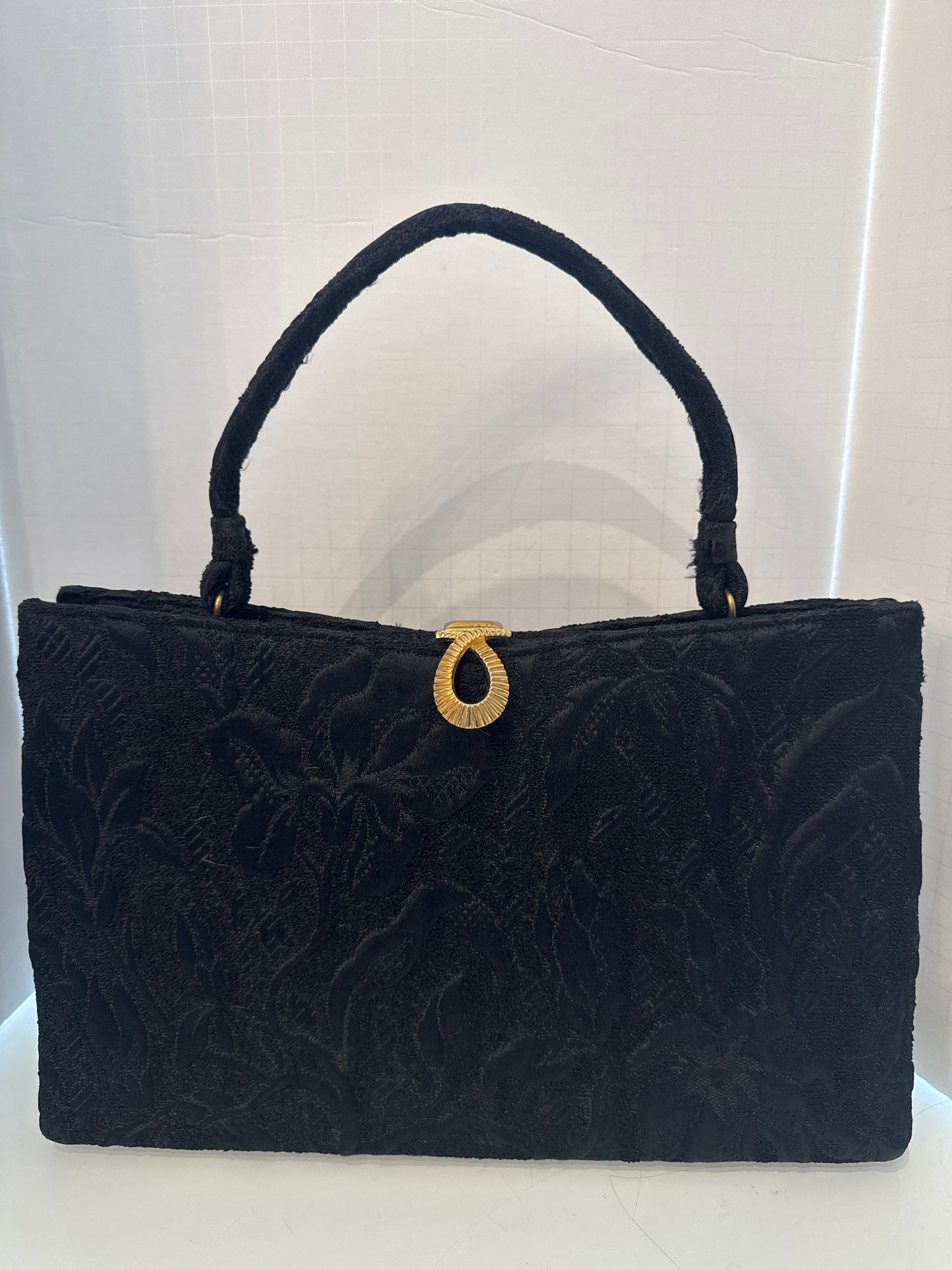 1960s fabric brocade black top handle handbag with decorative gold closure by LEWIS