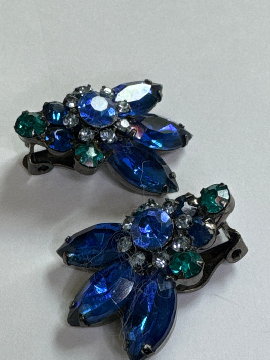 Gorgeous clip on teal and blue sapphire colored rhinestone earrings. Matching brooch sold separate separately.