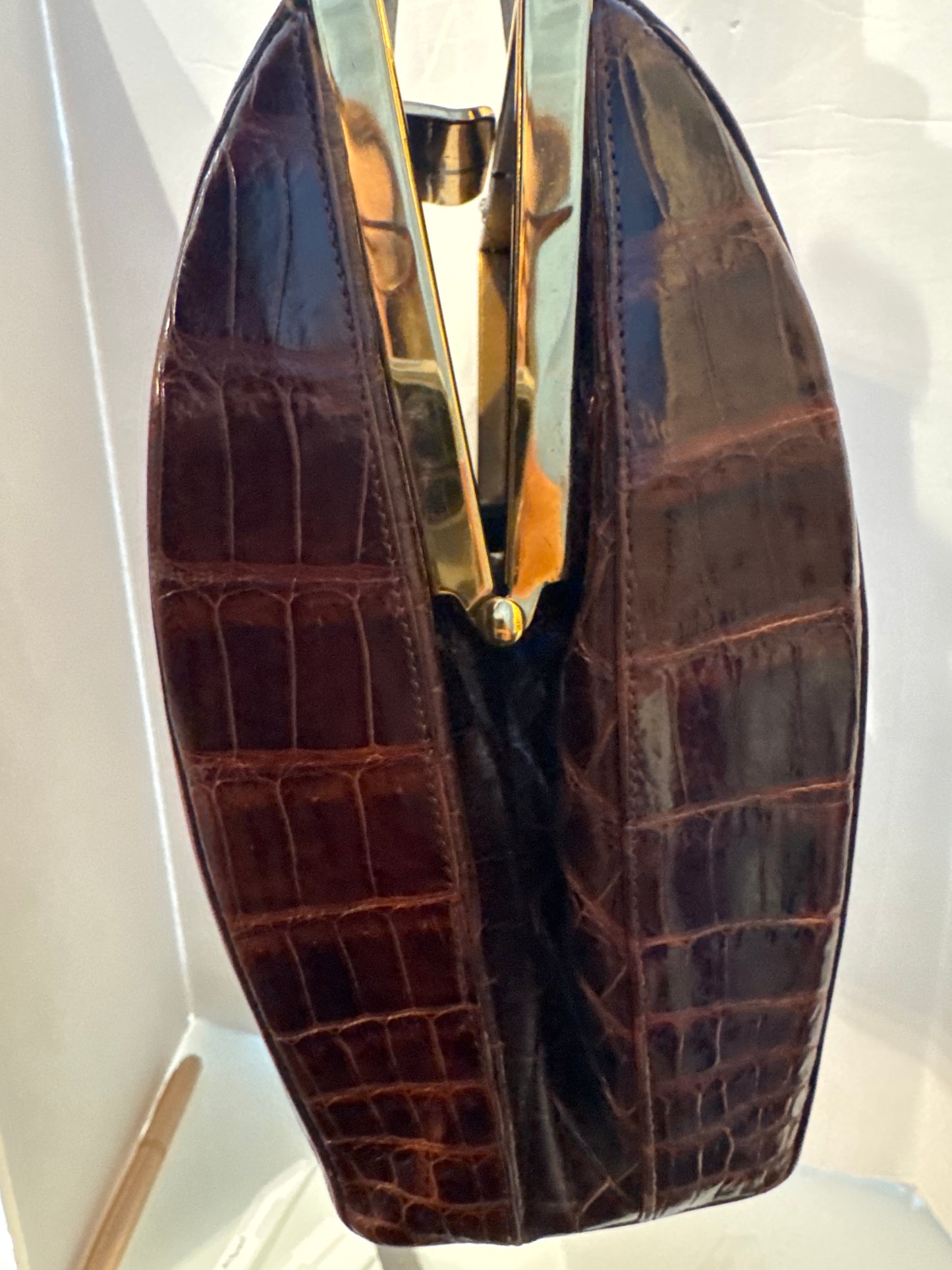 Fabulous 1950s brown alligator bag with original leather coin, purse, comb, and mirror