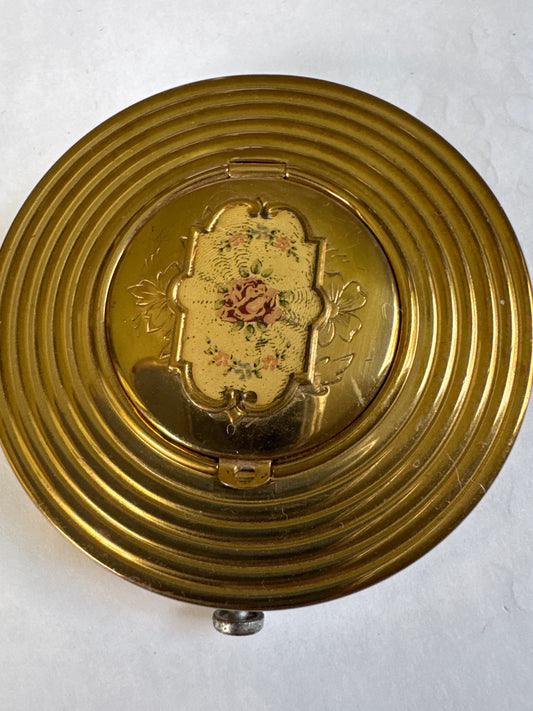 1940s vintage makeup powder compact with decorative top that is also a photo locket