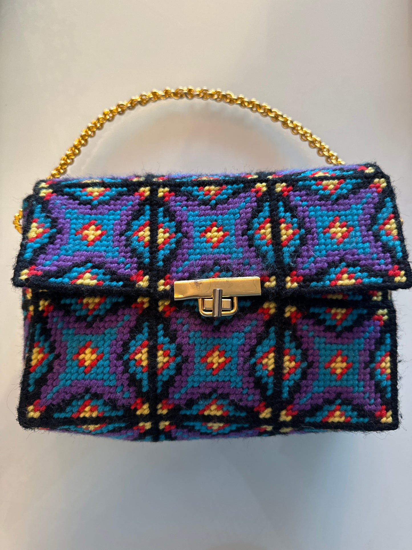 1970s handcrafted multicolored bag with gold tone handle