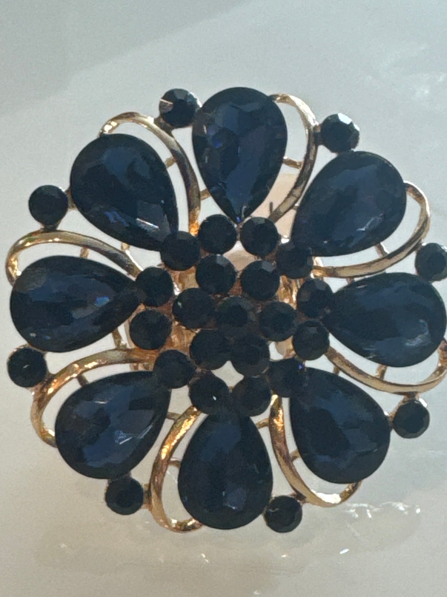 Fun adjustable oversized flower ring. Purchased in Paris.