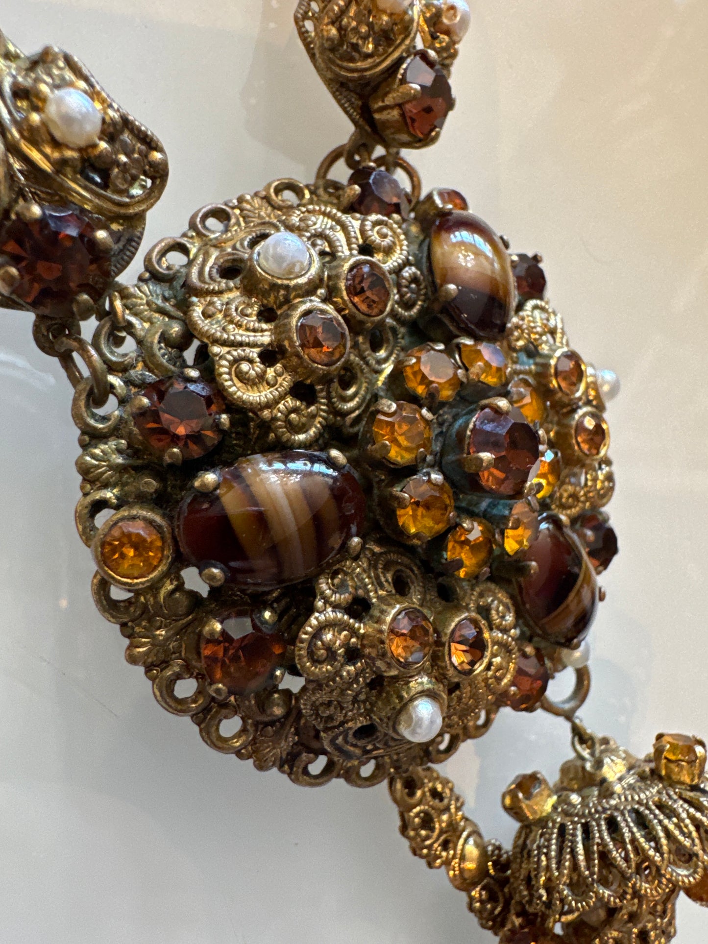Stunning 1930s pendant necklace with tiger eye, Amber colored rhinestones, and pearls, with dangle tassel. Found in Paris.