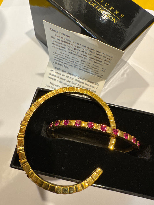 Joan Rivers classic collections rhinestone bangles, one pink one purple.