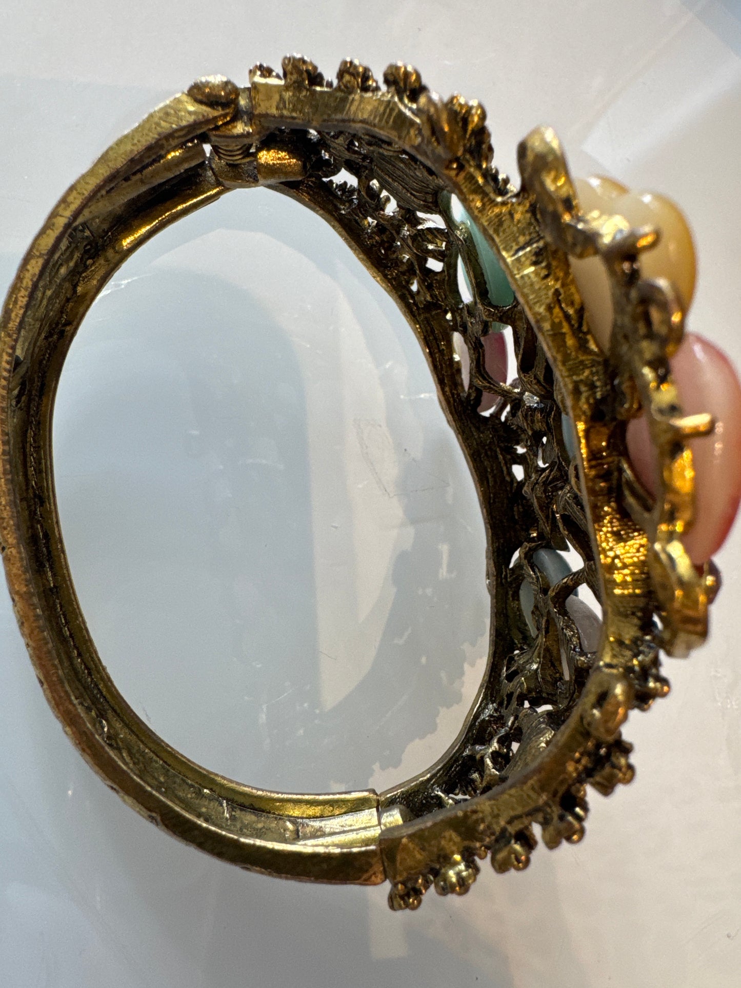 Beautiful 1980s clamper/cuff bracelet with colored rhinestones and heart shaped stones