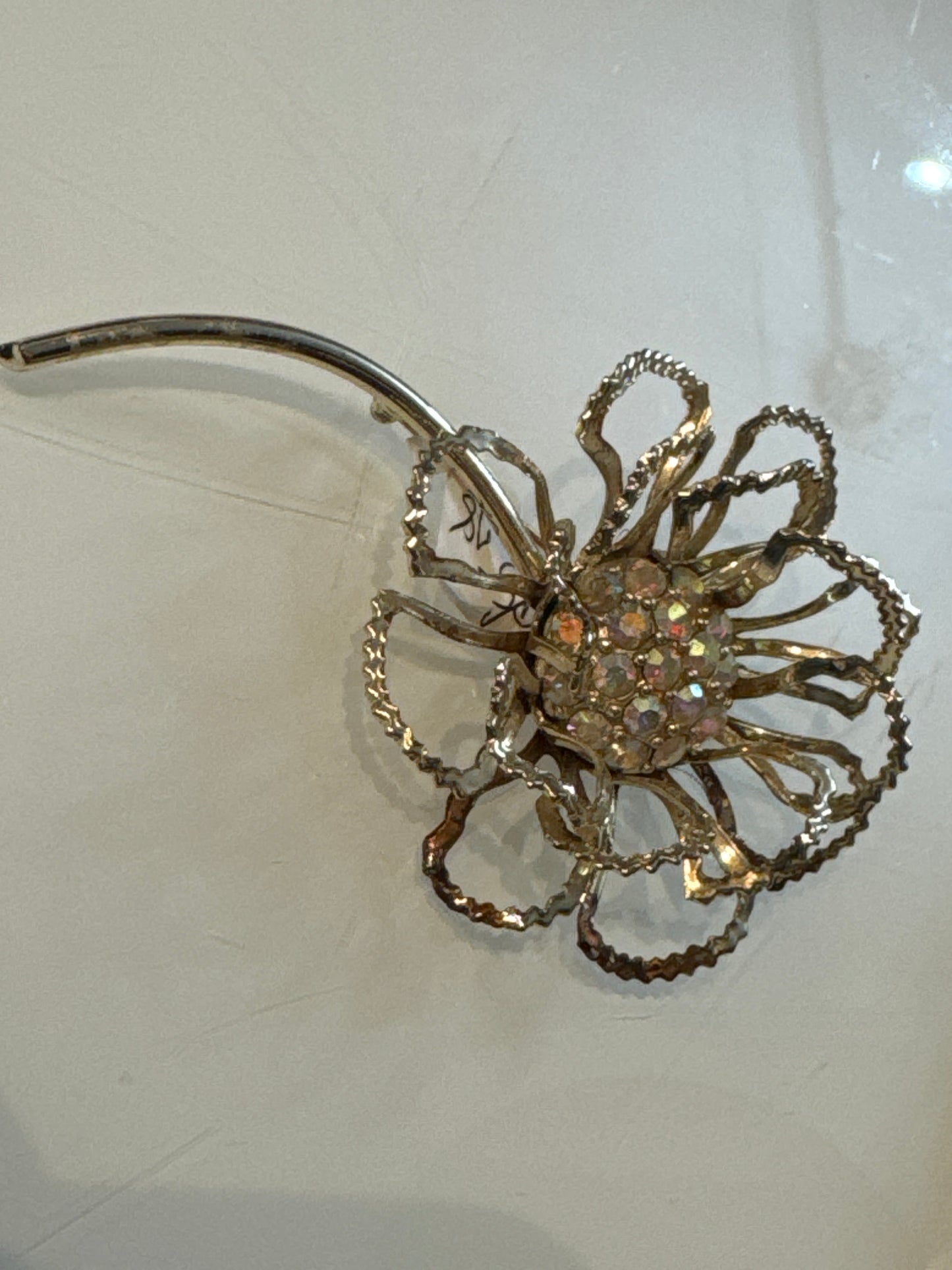 Beautiful jumbo sarah Coventry flower brooch in gold town with aurora borealis center