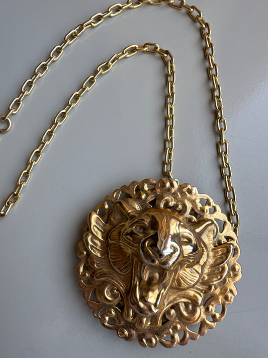 Vintage lion belt buckle reimagined as a pendant. Tom