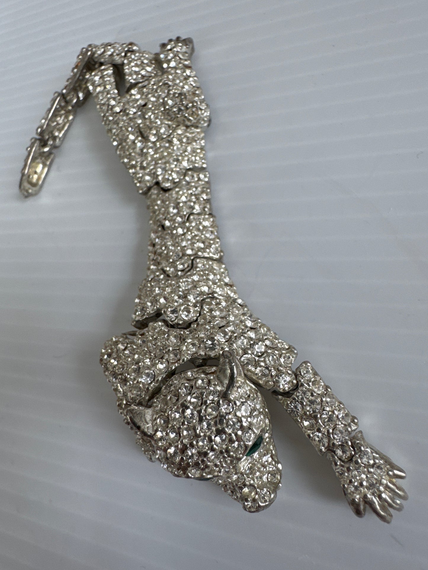 1950s beautiful crystal rhinestone articulated cheetah shoulder brooch with green emerald colored eyes