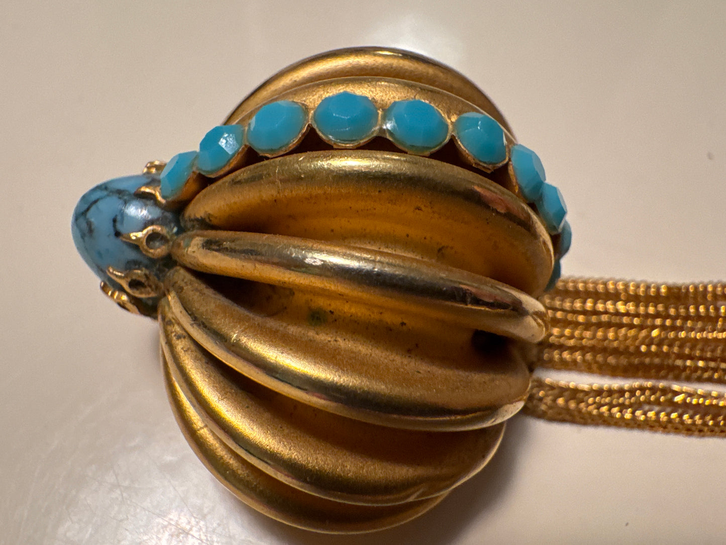 vintage 1960s gold tone brooch with tassel, dangle, and turquoise stones. Summer