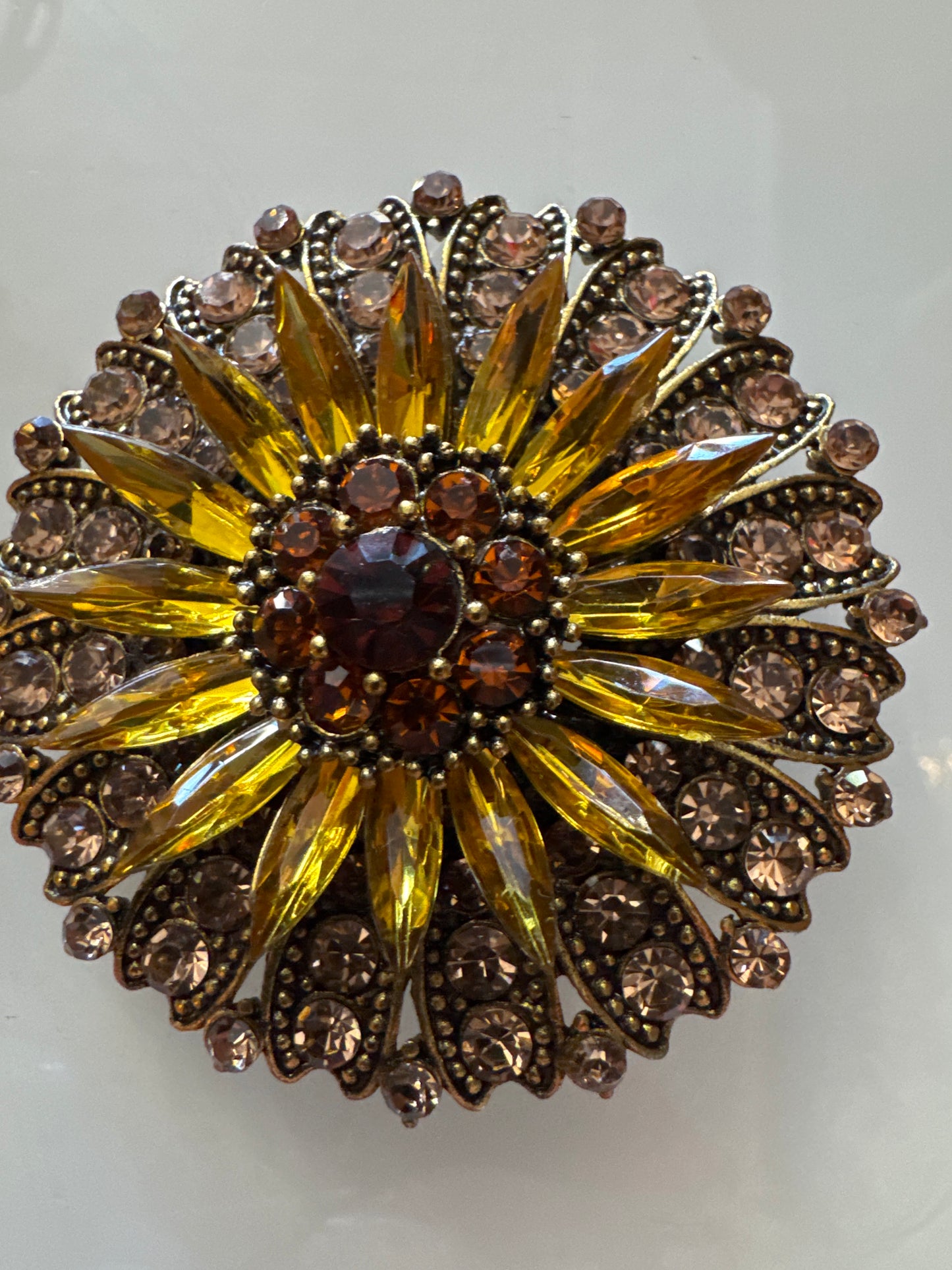Retro amber colored rhinestone brooch