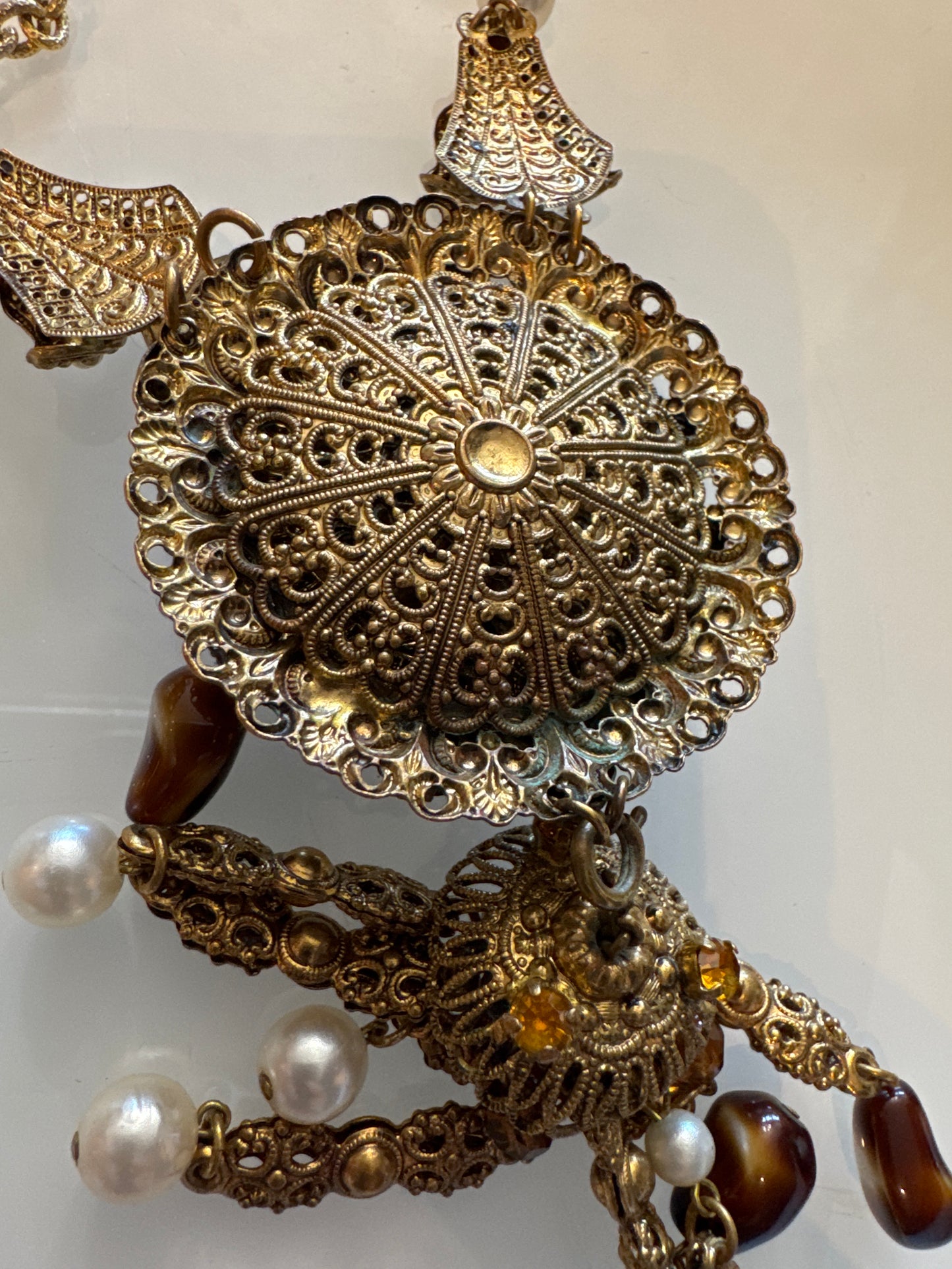 Stunning 1930s pendant necklace with tiger eye, Amber colored rhinestones, and pearls, with dangle tassel. Found in Paris.