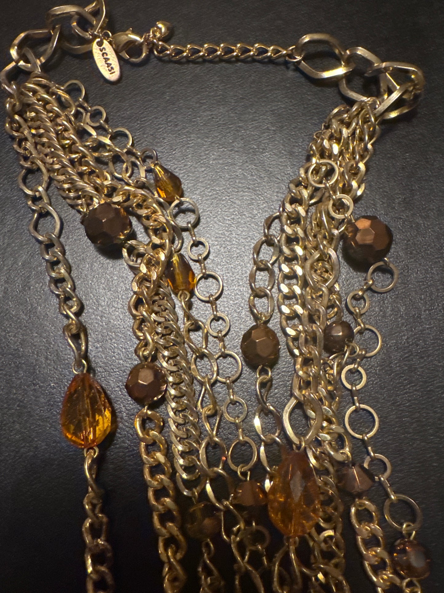 1970s multi strand, signed Scaasi in gold tone with bronze colored beads