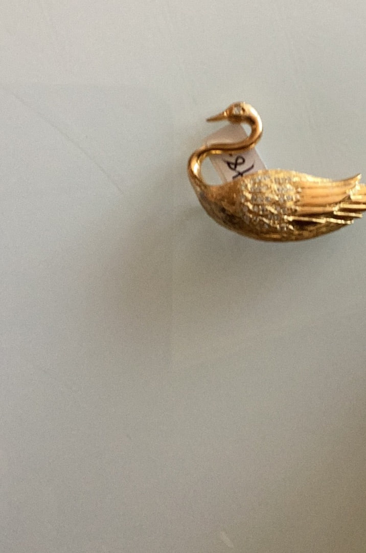 Gold tone swan brooch