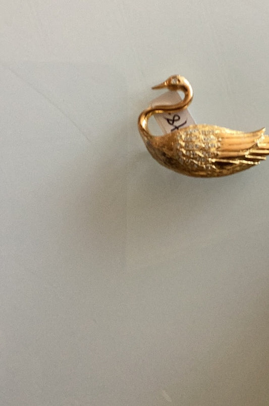 Gold tone swan brooch