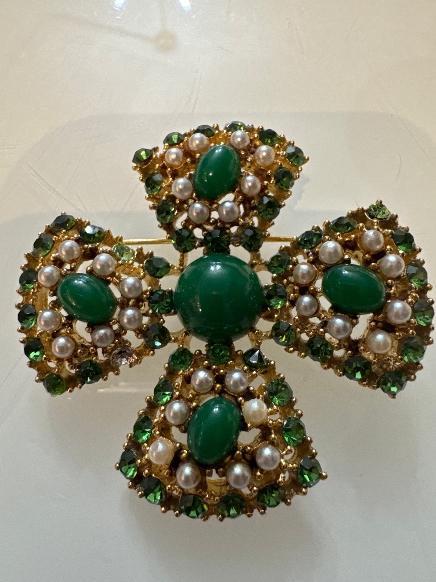 Beautiful WEISS Maltese cross with green cabochon stones, rhinestones, and pearls. NYC