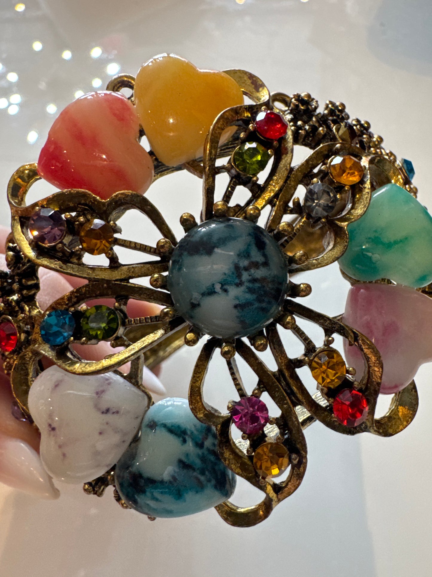 Beautiful 1980s clamper/cuff bracelet with colored rhinestones and heart shaped stones