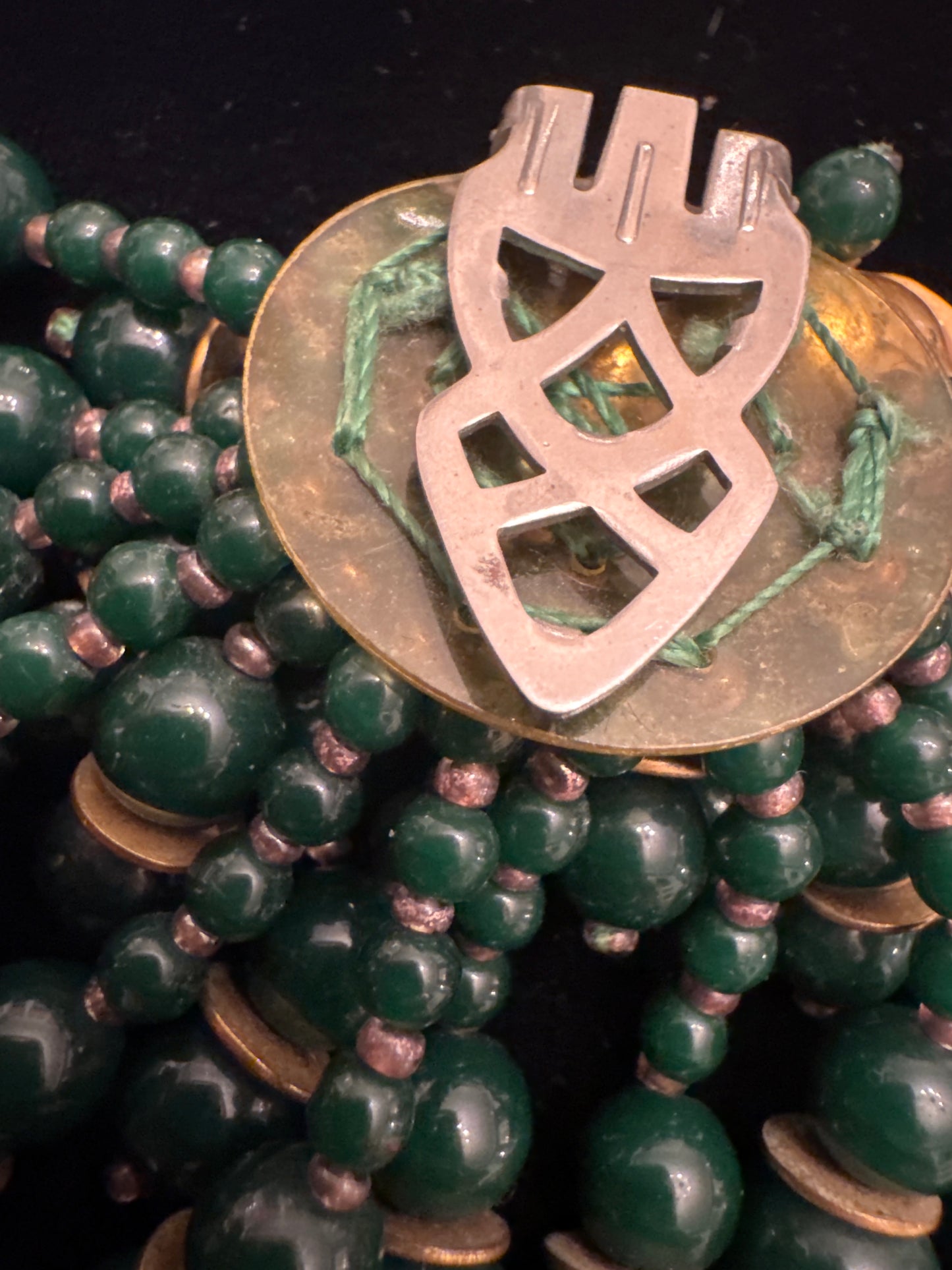 Beautiful vintage fur clip with green glass beads and gold tone flowers
