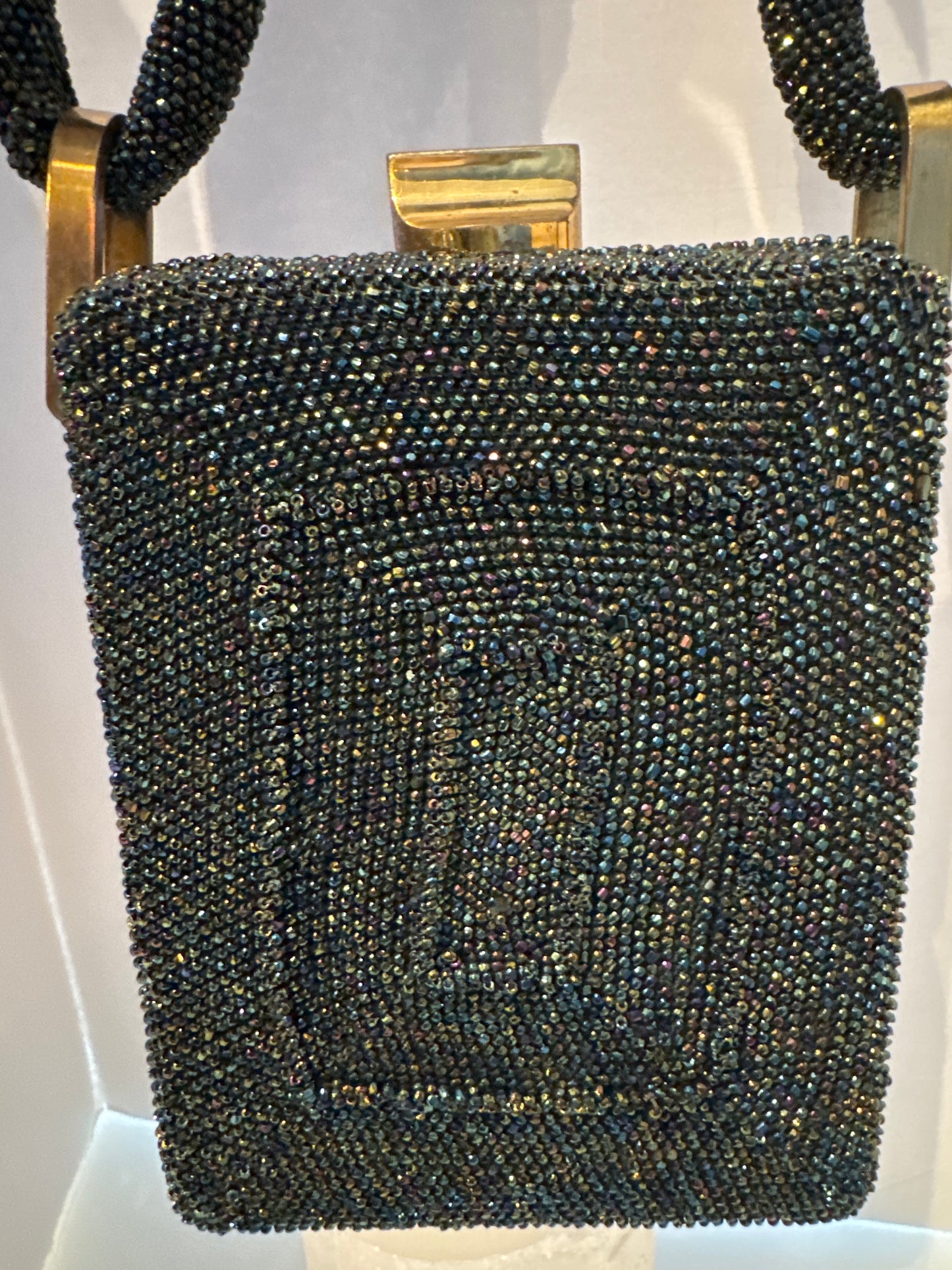 gorgeous 1940s beaded bag with dark green blue and bronze beading. Extra thick handle in mint condition.