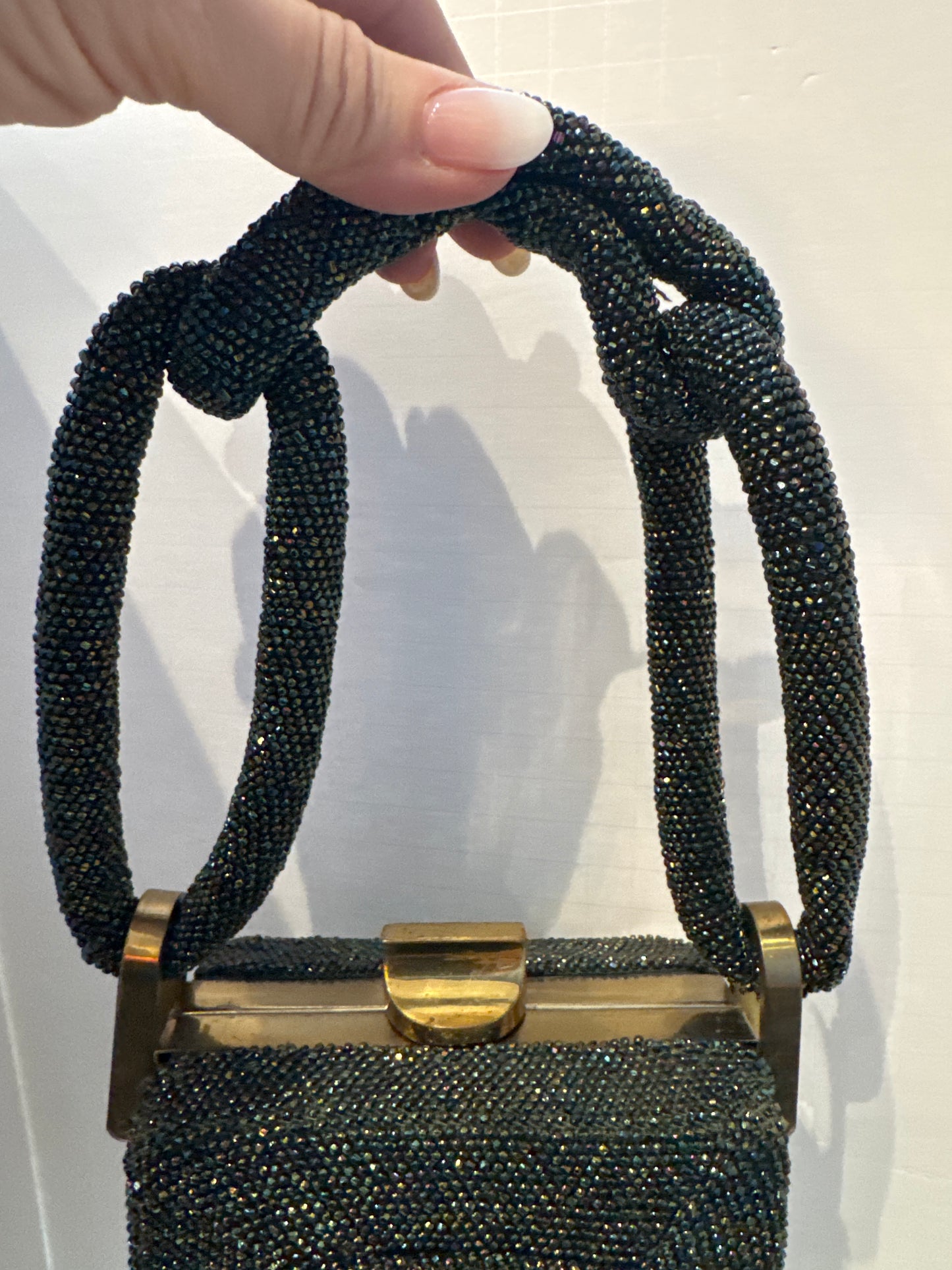 gorgeous 1940s beaded bag with dark green blue and bronze beading. Extra thick handle in mint condition.