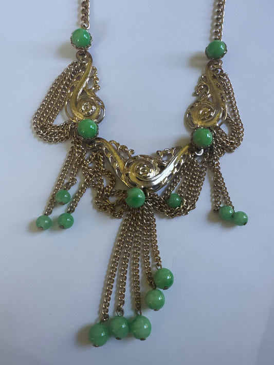 1960s/70 signed "NAP" NAPIER necklace with greene CABACHON stones and a paisley like filagree gold tone design