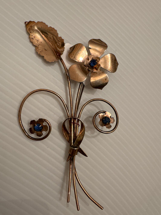 1940s sterling silver flower brooch with gold plating and blue stones