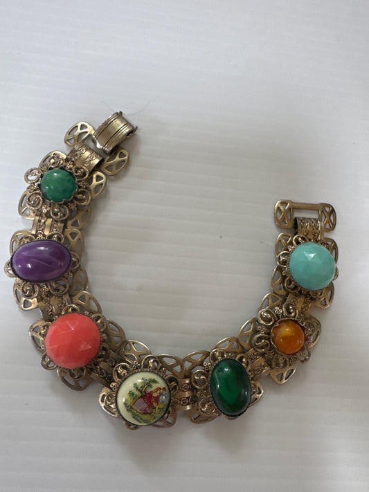 vintage book chain bracelet featuring courting couple and colored cabochon stones
