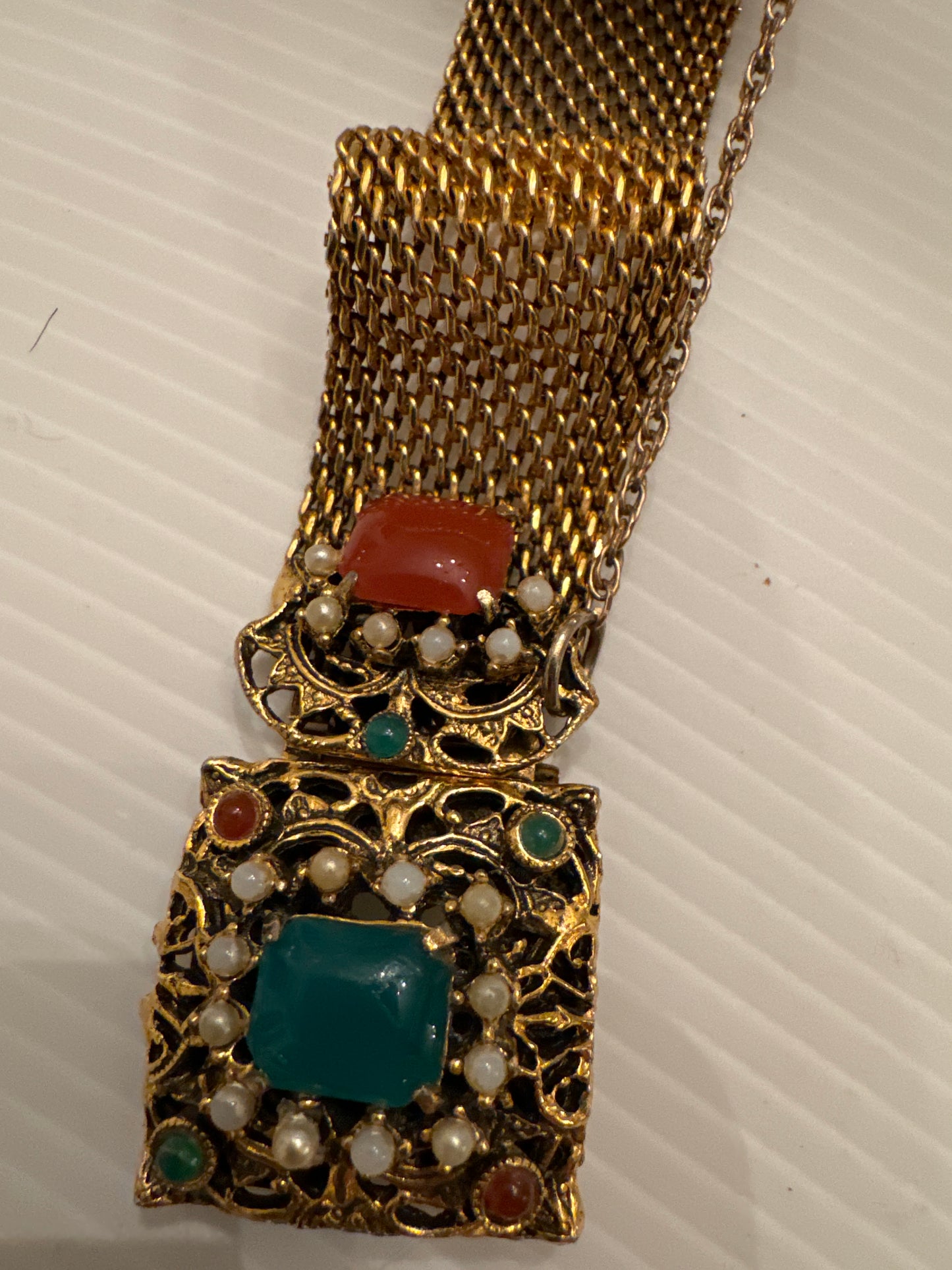 1940s gold tone mesh bracelet with pearls and stones. Safety latch.