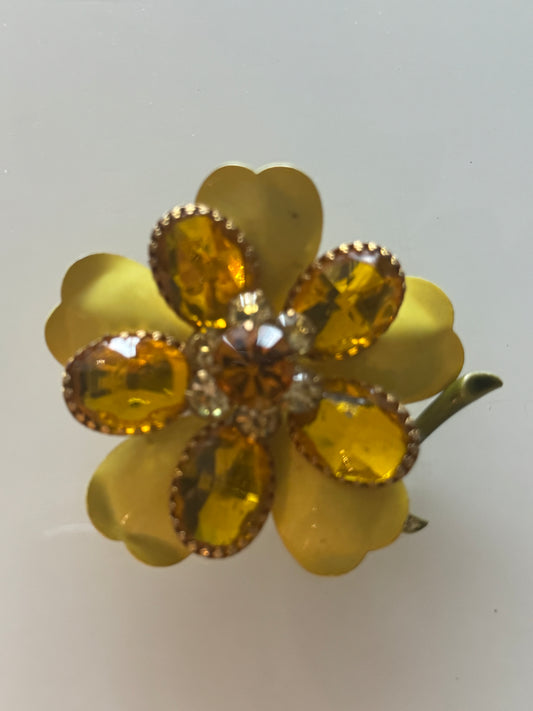 Yellow flower brooch with yellow rhinestones and tucked away stem