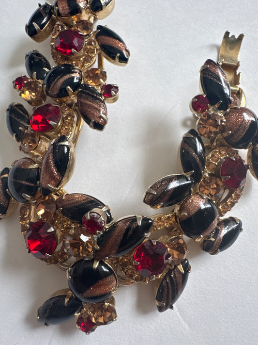 WOW! Rare D & E Juliana multi layered black bracelet with red and topaz rhinestones along with black and gold confetti style stones