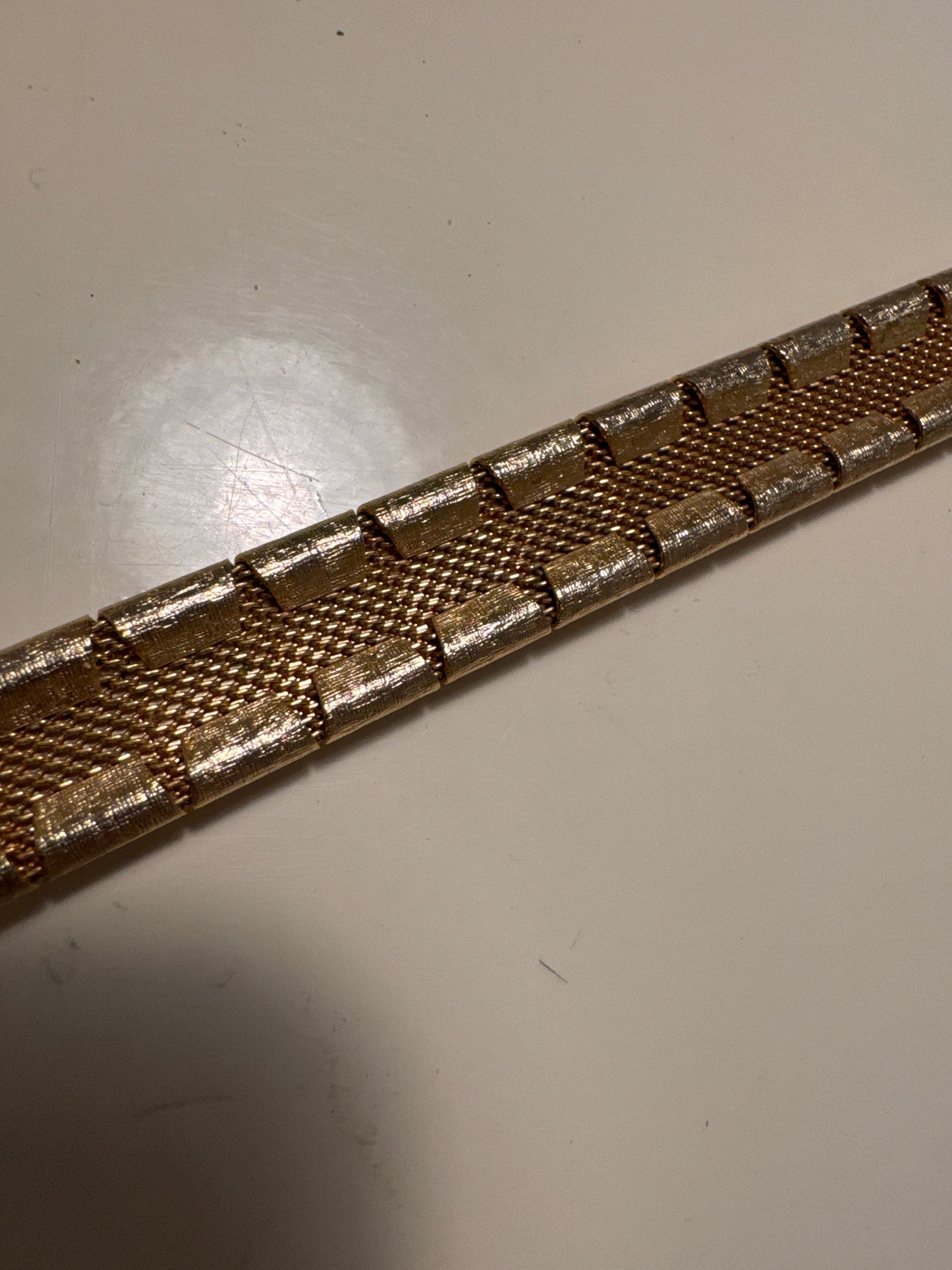 1960s Lavastone gold tone with mesh backing bracelet. measures 7 1/2 inches