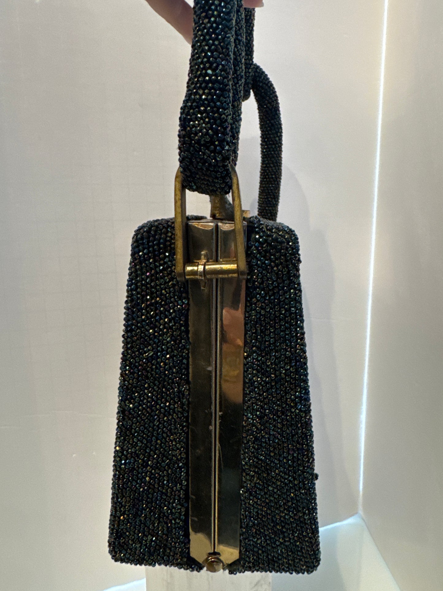 gorgeous 1940s beaded bag with dark green blue and bronze beading. Extra thick handle in mint condition.