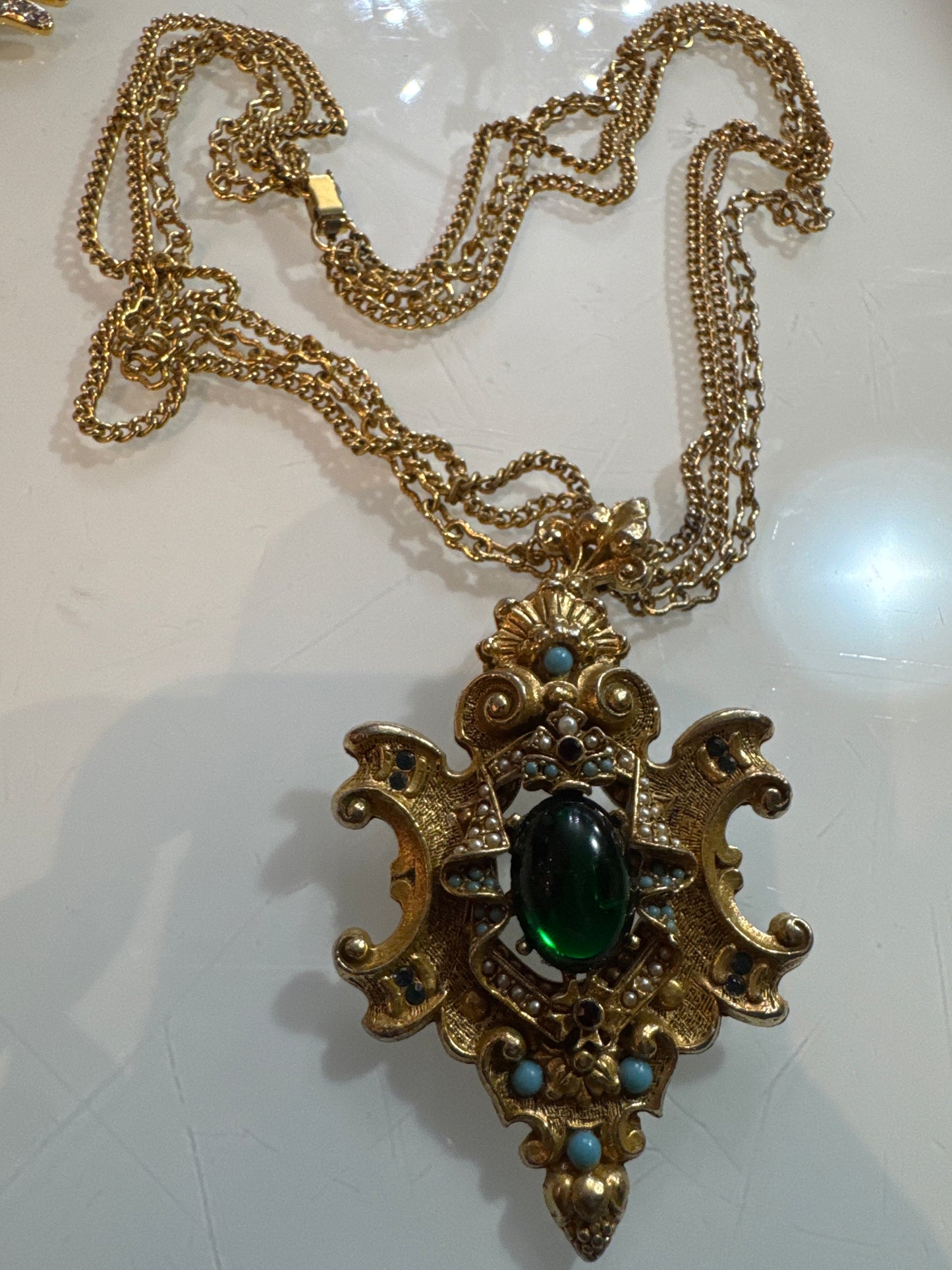 Arthur Pepper multi strand pendant necklace with green center stone, turquoise, pearl and rhinestones