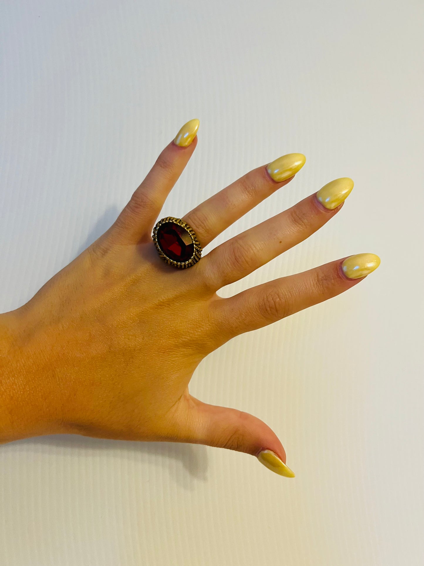 Vintage brass tone ring with ruby like gem