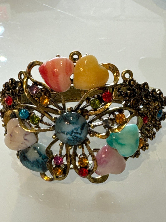 Beautiful 1980s clamper/cuff bracelet with colored rhinestones and heart shaped stones
