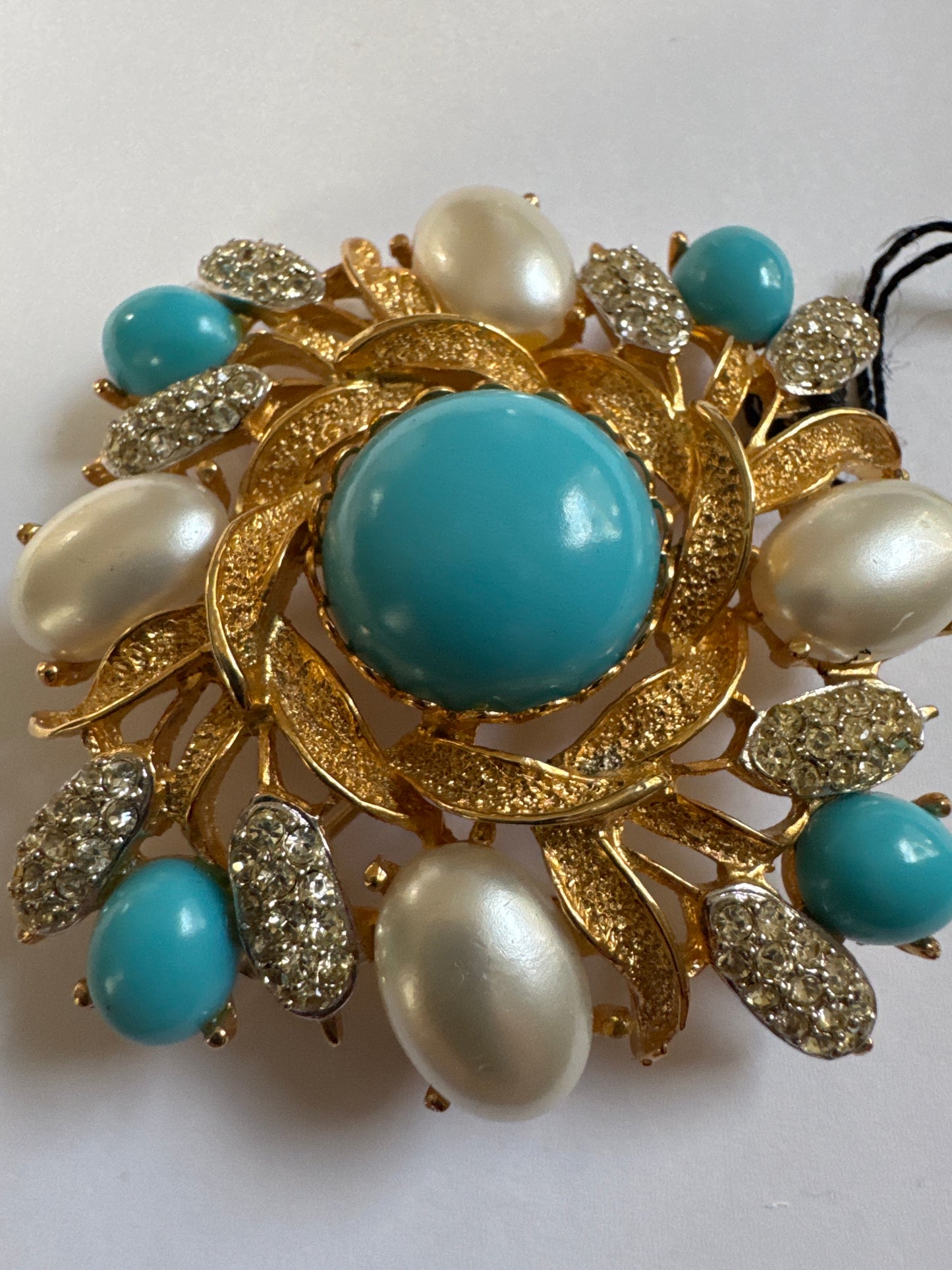 1960s vintage signed KJL Laguna gold tone, brooch with turquoise and faux pearl cabochon and clear rhinestones. Original tag attached.
