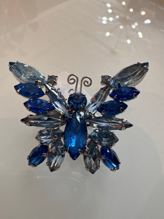 Gorgeous vintage 1950s Silvertone butterfly with light and dark blue rhinestones