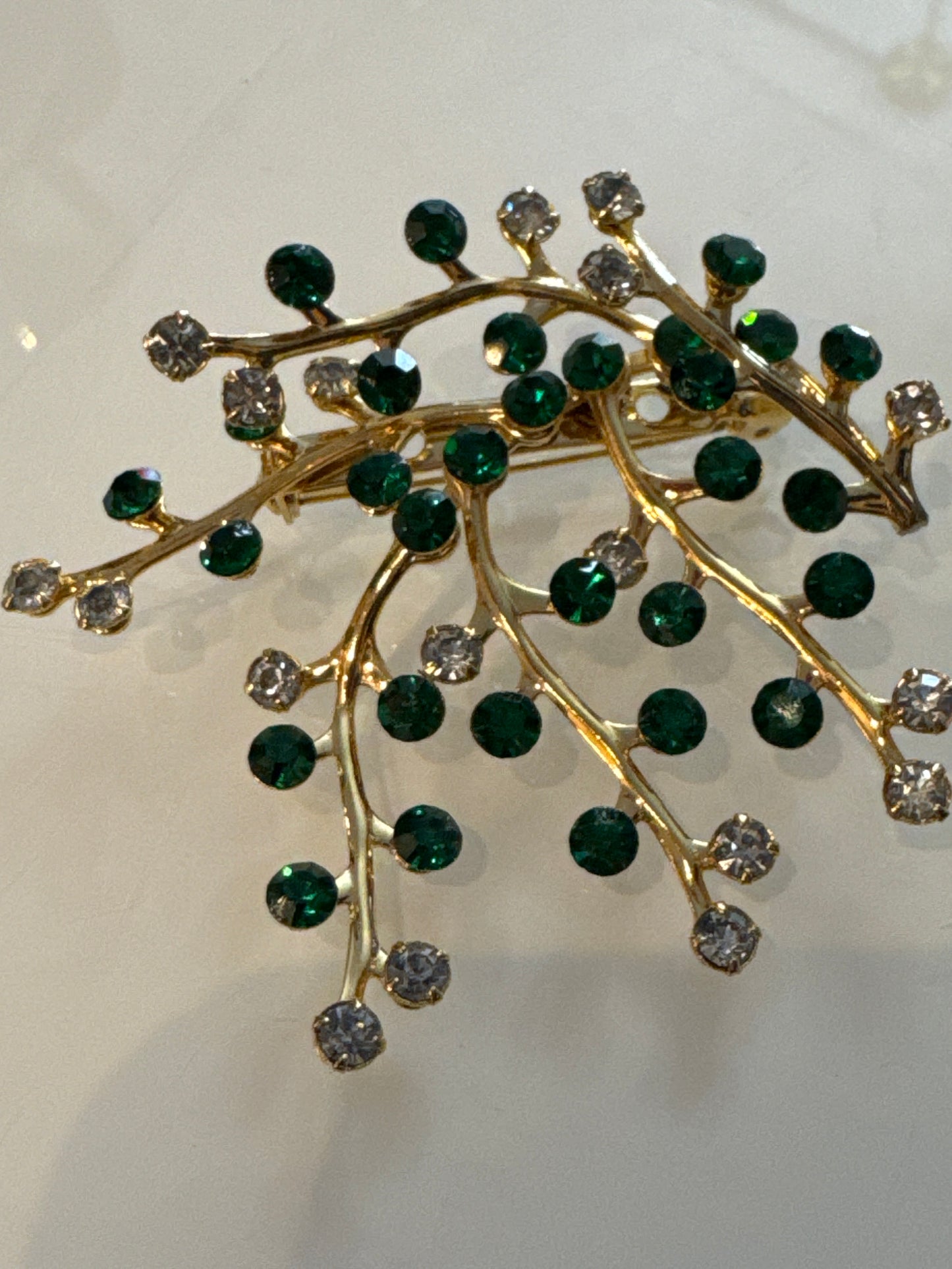 Beautiful unsigned, green and clear rhinestone branch brooch. Stones are super sparkly.