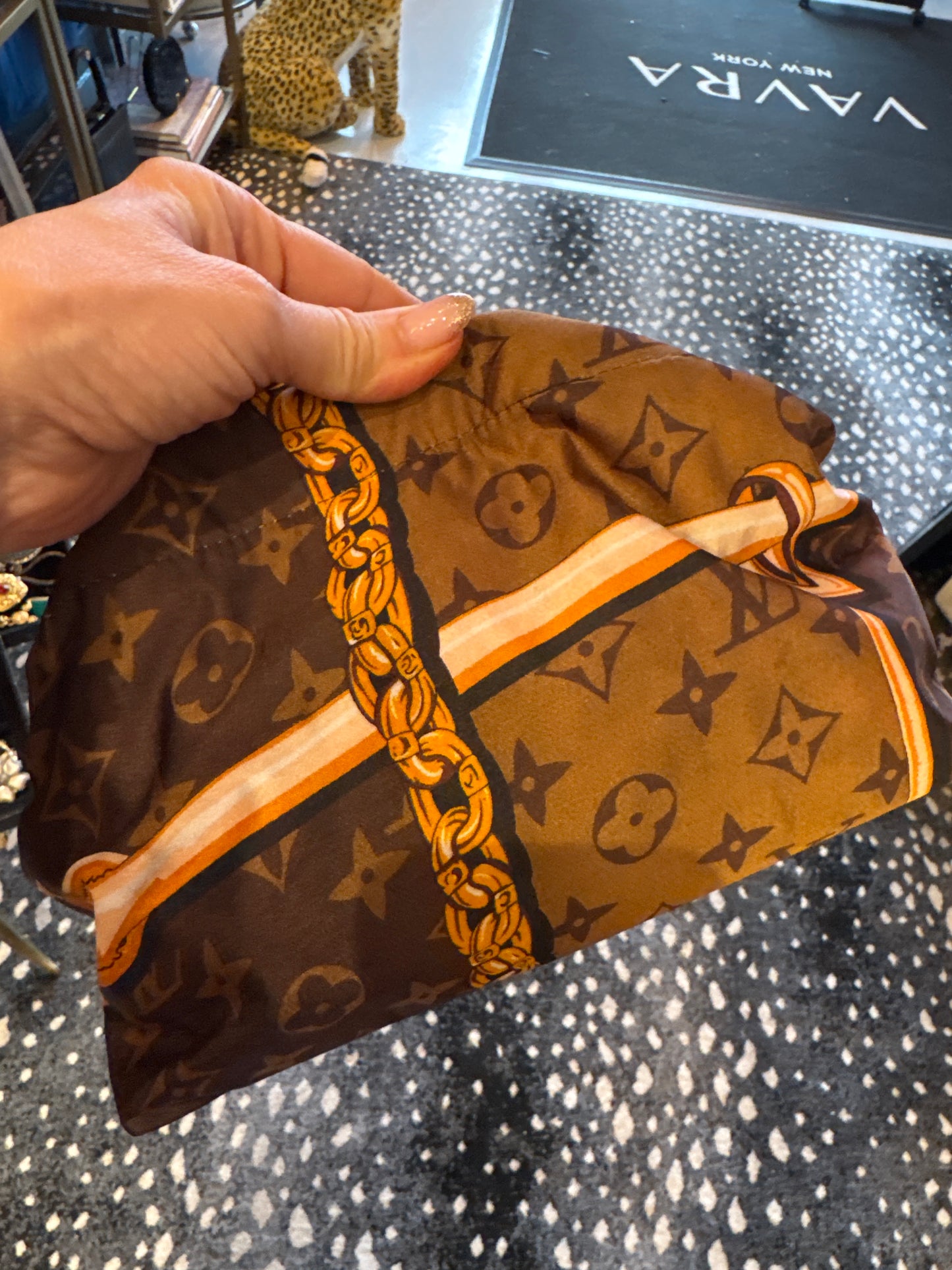 Vintage mini brown silk scarf reimagined as a clutch bag. Comes with crossbody chain shown