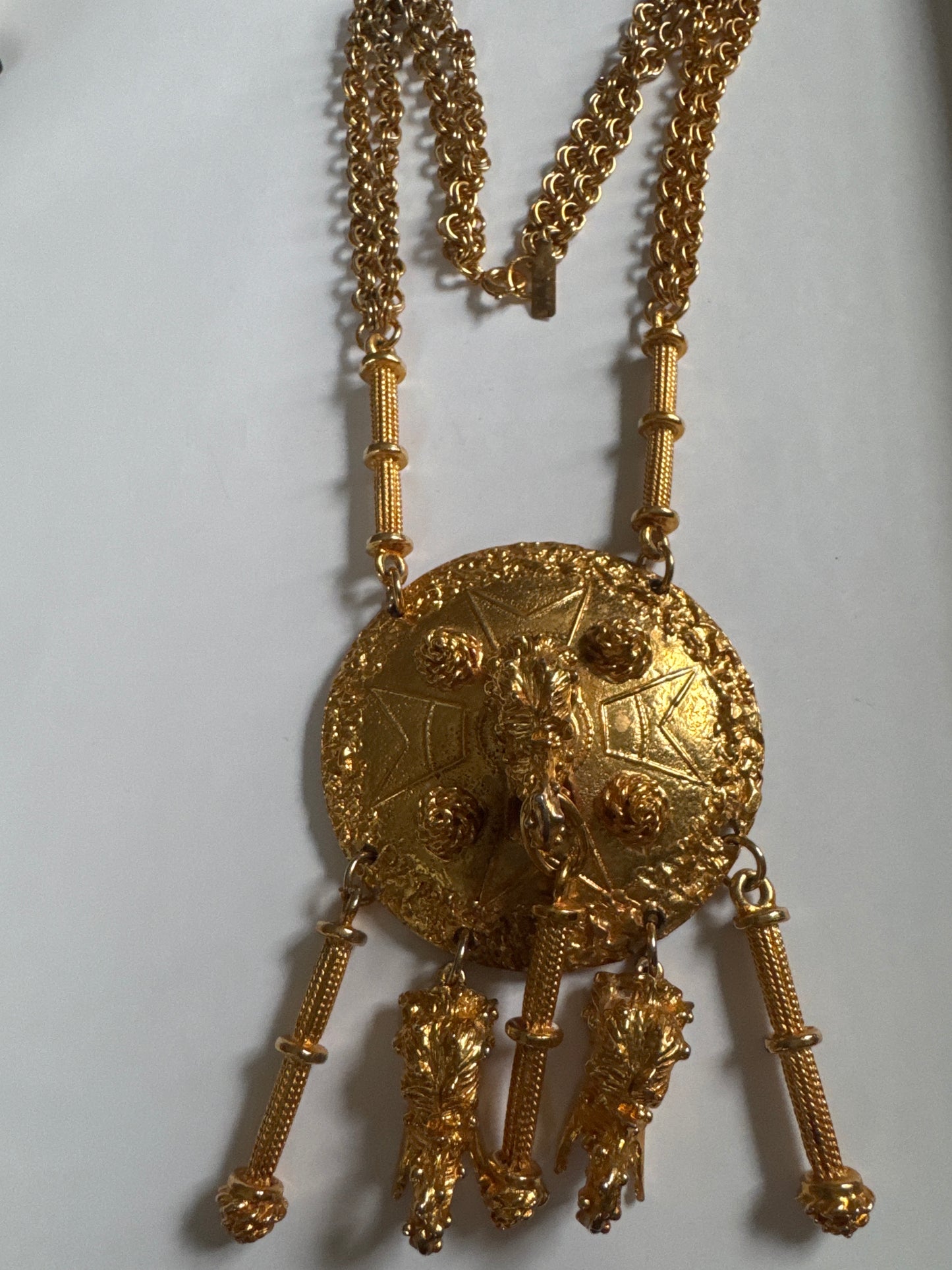 Signed 1960s Pauline Rader signed gold tone necklace. The two elephant heads that dangle at the bottom of the pendant are hollow. Double chains on each side. It's heavy!